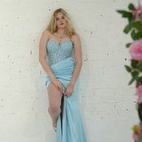 Dazzling baby blue mermaid gown featuring a beaded corset bodice, thigh-high slit, and elegant train.