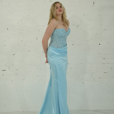 Dazzling baby blue mermaid gown featuring a beaded corset bodice, thigh-high slit, and elegant train.