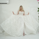 A-line wedding dress featuring 3D florals, sparkling lace, and a modern slit for hire