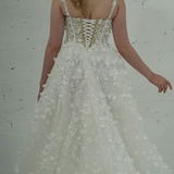 A-line wedding dress featuring 3D florals, sparkling lace, and a modern slit for hire