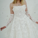 romantic white ballgown adorned with floral lace and enchanting 3D floral details.