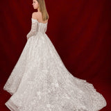 ballgown wedding dress with floral lace and elegant off-shoulder sleeves.