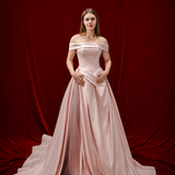 baby pink ballgown with elegant draping and a timeless silhouette.