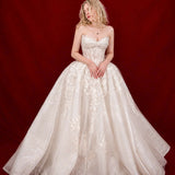 ballgown wedding dress with floral lace and dramatic detachable bow