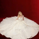ballgown wedding dress with floral lace and dramatic detachable bow