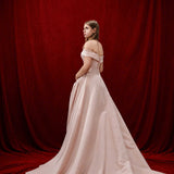 baby pink ballgown with elegant draping and a timeless silhouette.