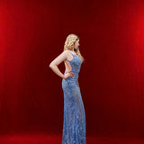 Ethereal blue elegance with floral embellishments and a dramatic thigh-high slit.