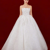 sparkling white ballgown with a sculpted corset and enchanting 3D details.