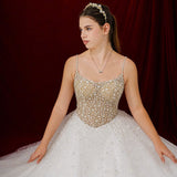 white ballgown featuring sparkling floral embellishments and an elegant corset silhouette fore hire