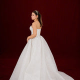sparkling white ballgown with a sculpted corset and enchanting 3D details.
