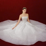 sparkling white ballgown with a sculpted corset and enchanting 3D details.