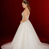 white ballgown featuring sparkling floral embellishments and an elegant corset silhouette.
