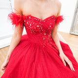 Dark red sparkling princess dress with off the shoulder feathers for hire