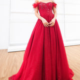 Dark red sparkling princess dress with off the shoulder feathers for hire