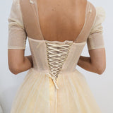 Sparkling light gold tulle princess dress with sleeves for hire