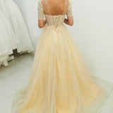 Sparkling light gold tulle princess dress with sleeves for hire