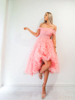 Pastel pink straight neck line with off the shoulder and tulle skirt up to the knees for hire.