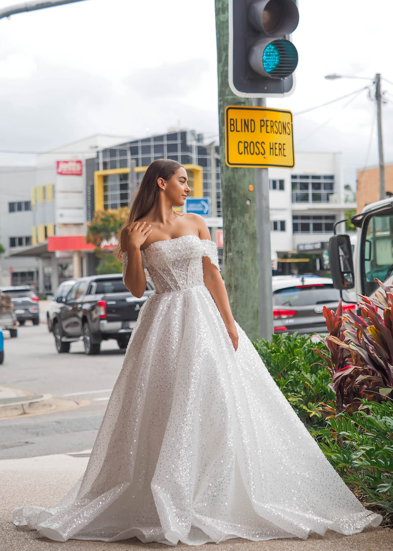Larisa white sequins and beads all over the dress with off the shoulder sleeves for hire