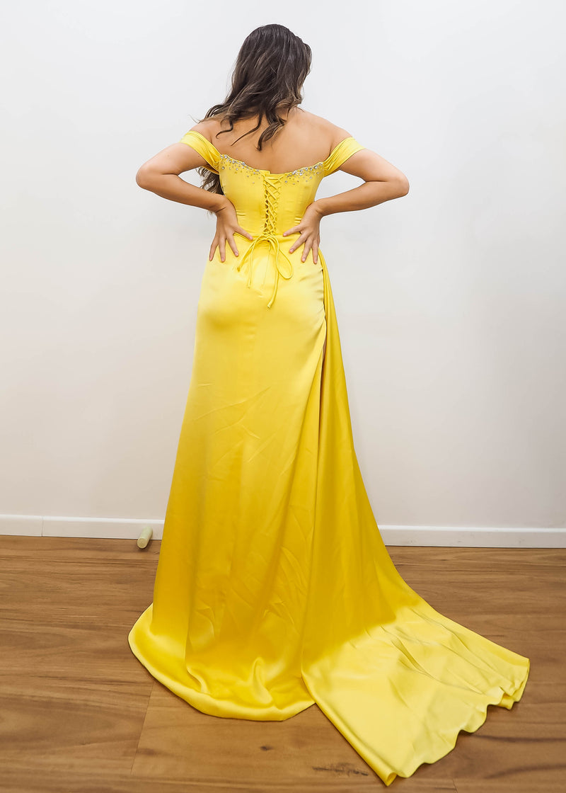 Cecilia in bright yellow satin column dress with off the shoulder and high slit