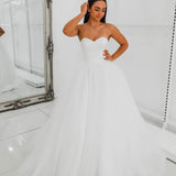 White sweetheart neckline and satin bodice with puffy tulle skirt wedding dress