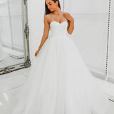 White sweetheart neckline and satin bodice with puffy tulle skirt wedding dress