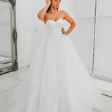 White sweetheart neckline and satin bodice with puffy tulle skirt wedding dress