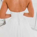 White sweetheart neckline and satin bodice with puffy tulle skirt wedding dress