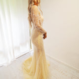 Sparkling Gold Beaded Deep V Mermaid Dress with long sleeves for hire.