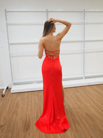 Bright red satin dress with wavy neckline and ruching high slit